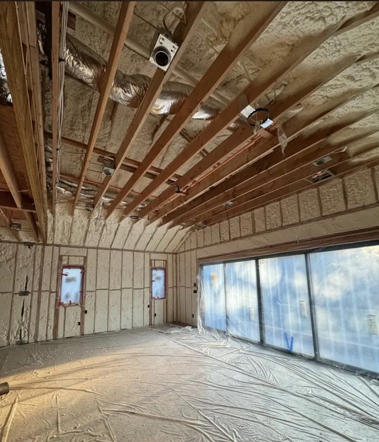 Interior walls and ceiling insulated with spray foam during new construction in Whiskey Creek
